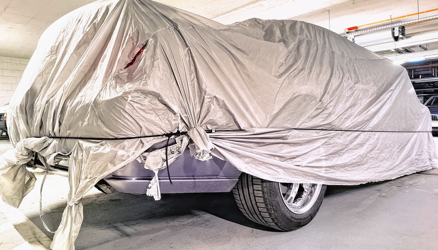 covered car in garage