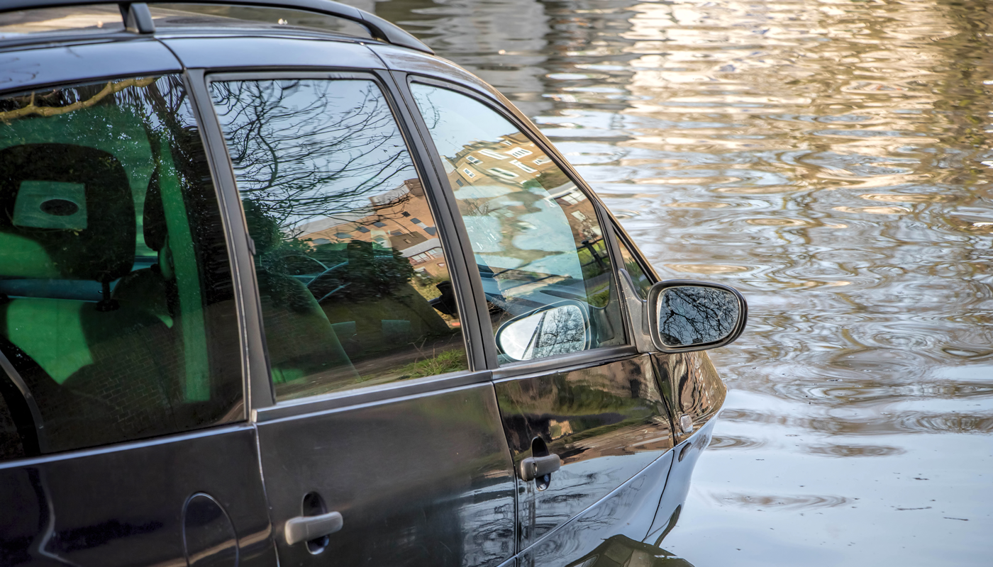 Car submerged in flood water.