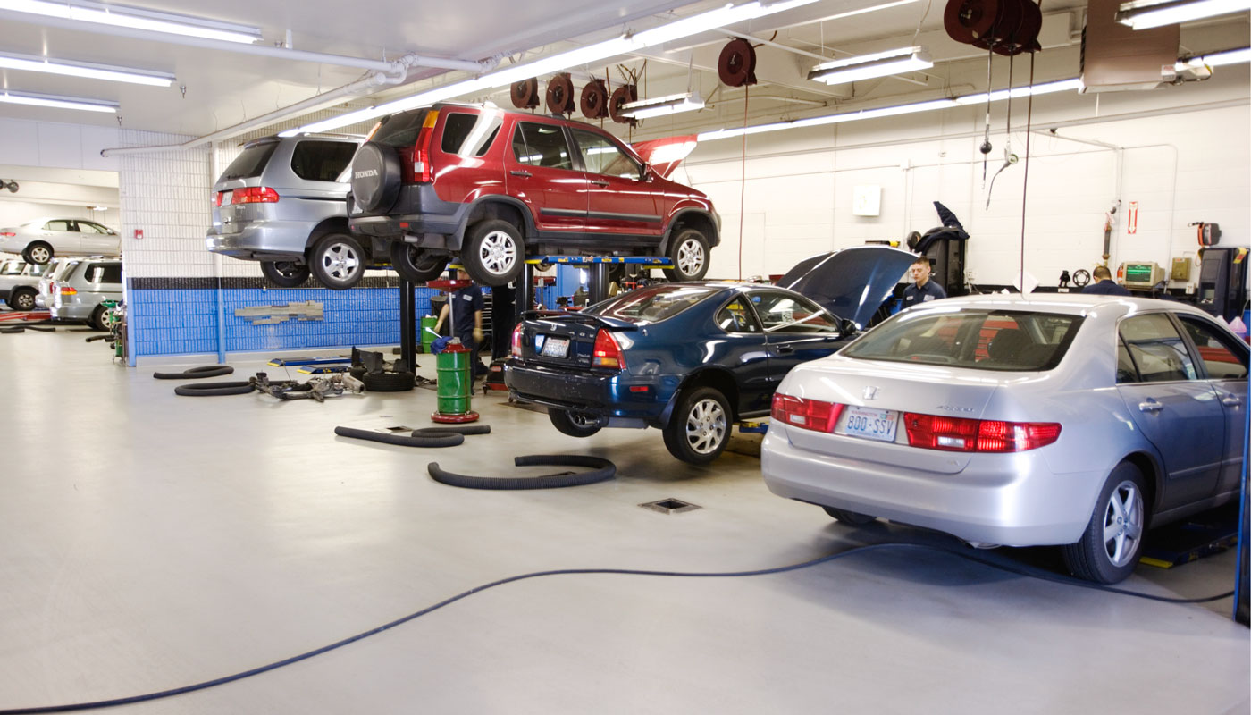 cars inside a mechanic shop