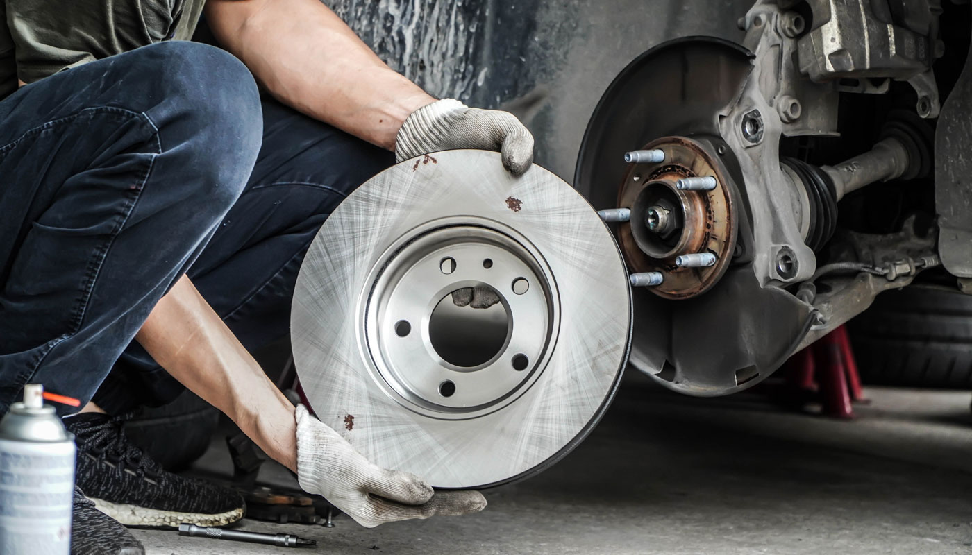 Mechanic installing Brand new brake discs