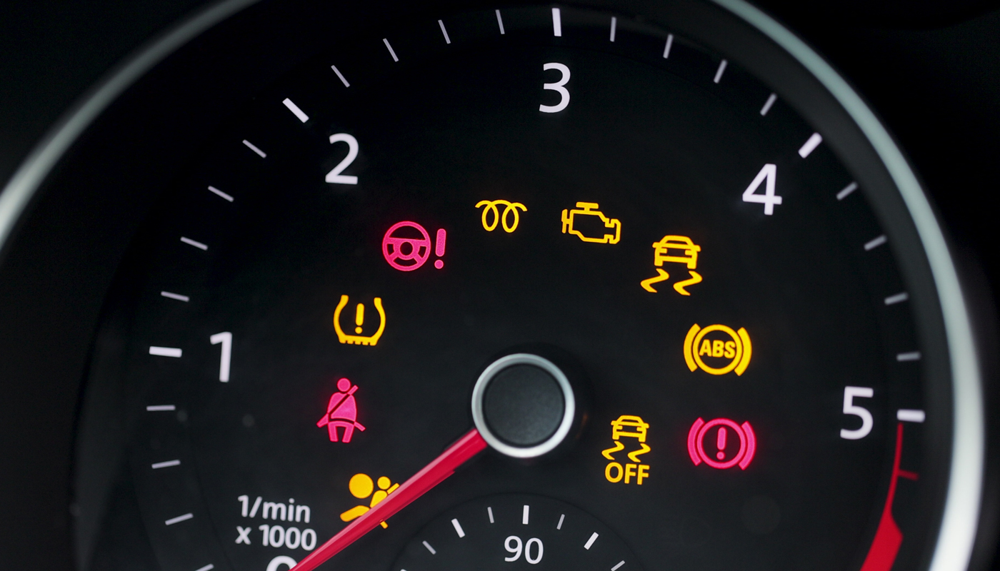 Many different car dashboard lights with warning lamps illuminated. Light symbol that pops up on dashboard when something goes wrong with the engine