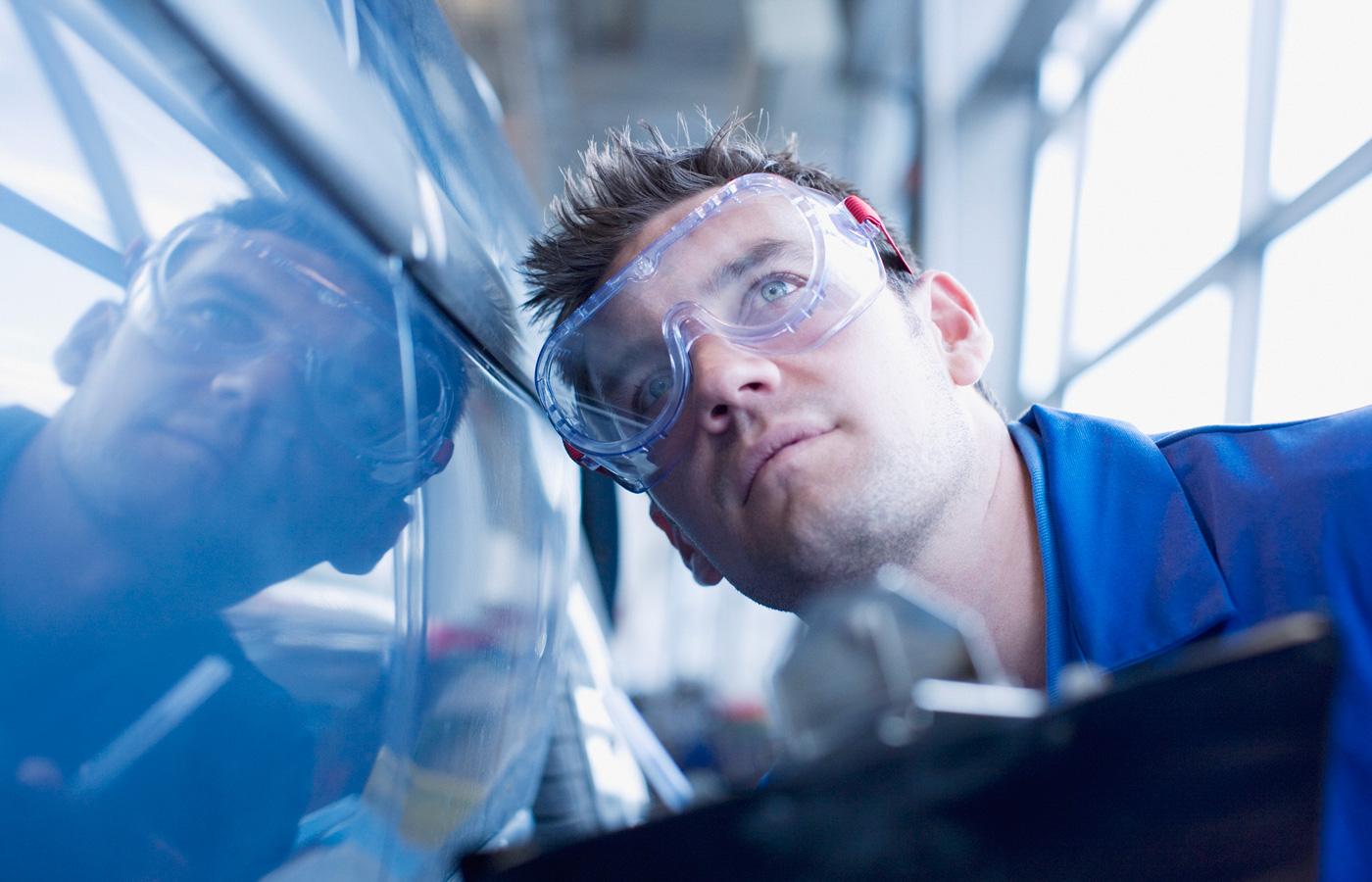 mechanic inspecting a vehicle