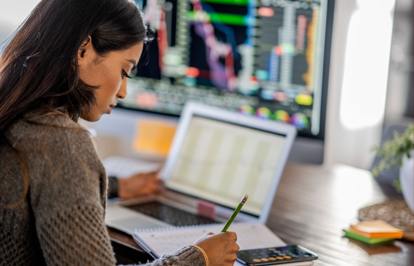 Woman doing financials on a laptop