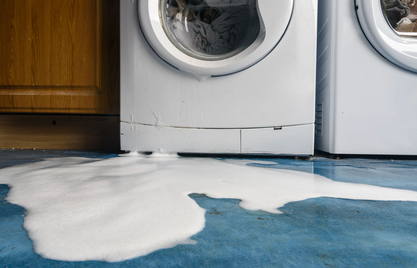 leaking washing machine in a home