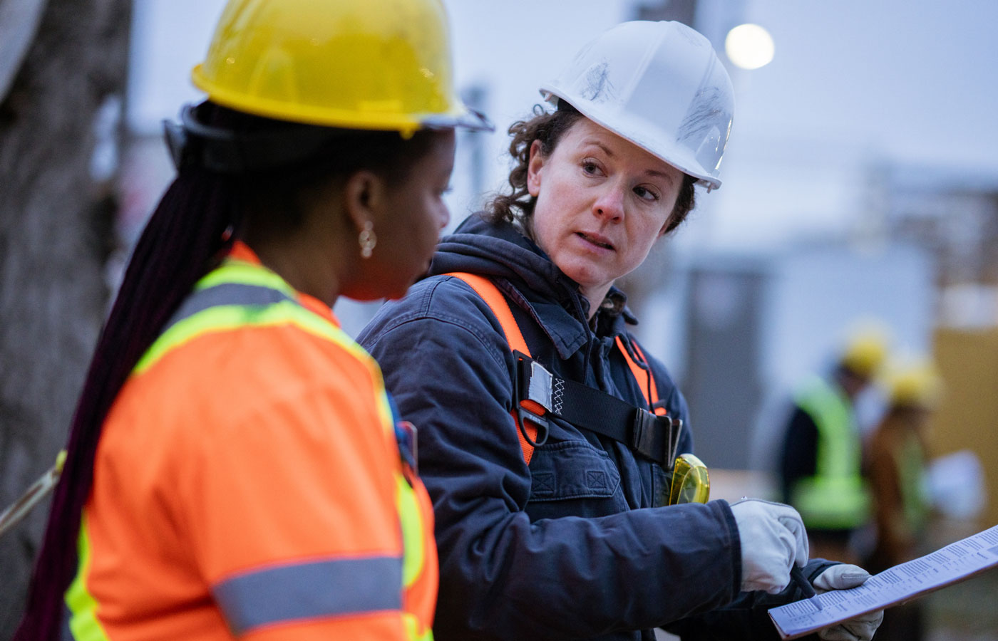 Two women working on construction site