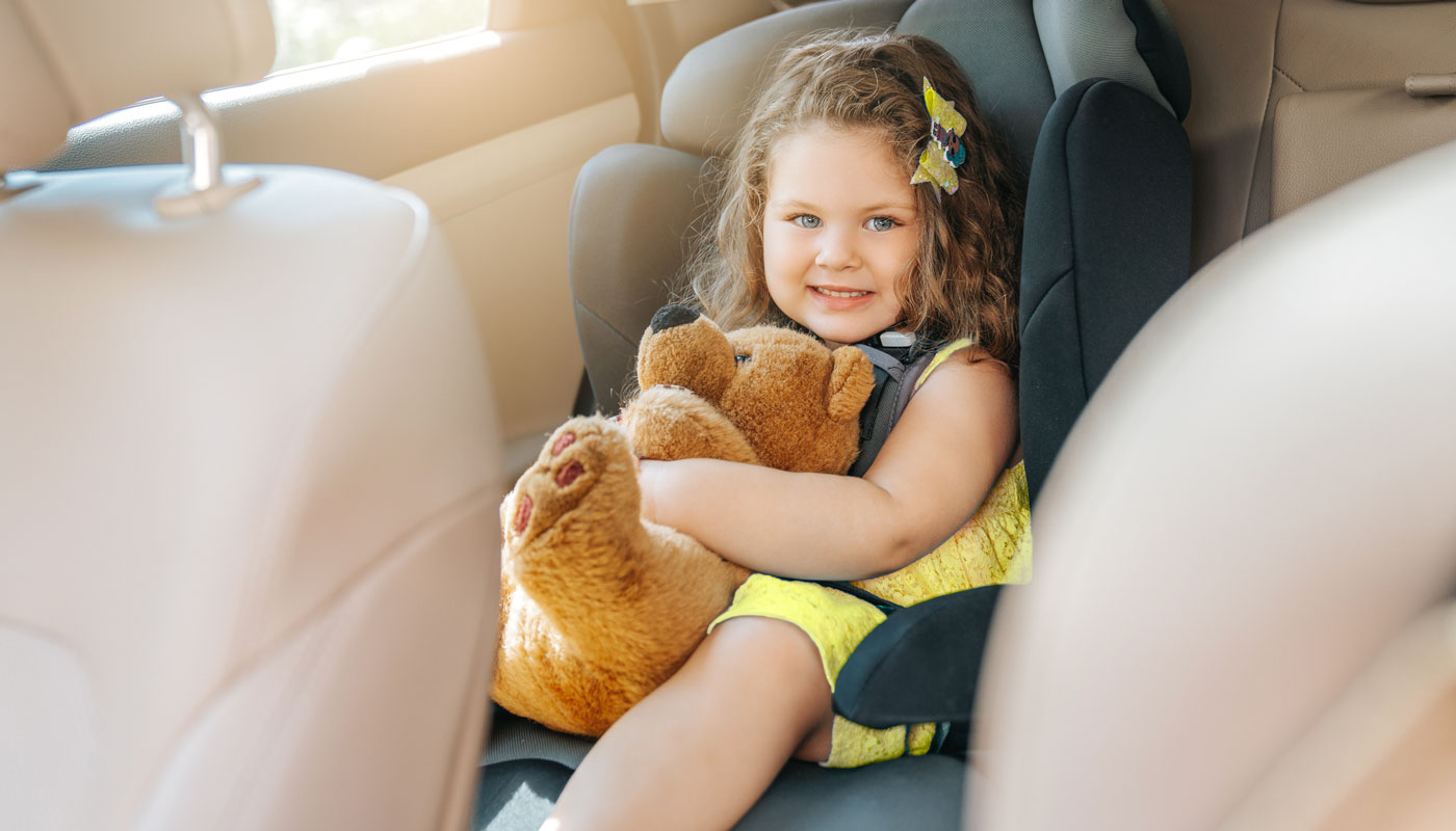 young child in a car seat in a car