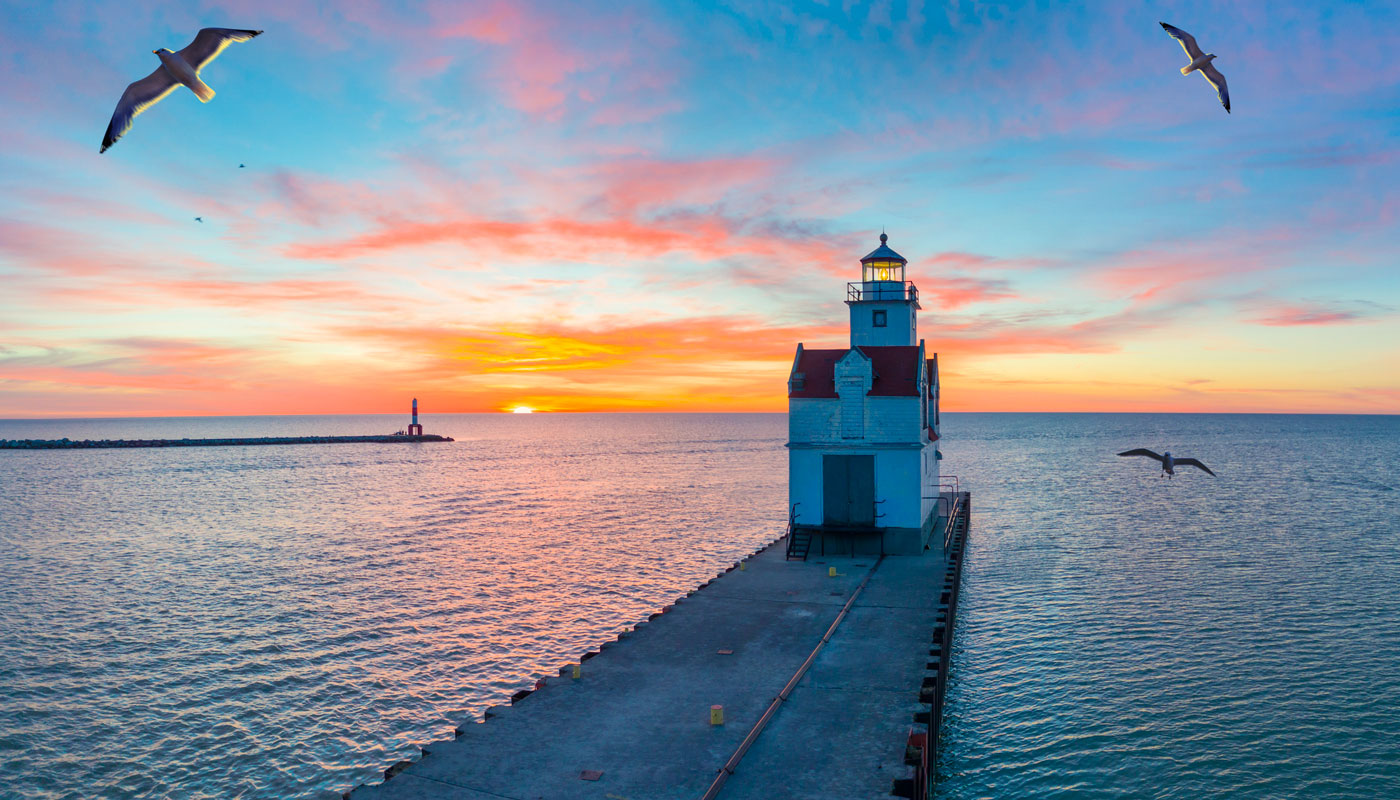 Sunrise over Lake Michigan scenic harbor and lighthouse