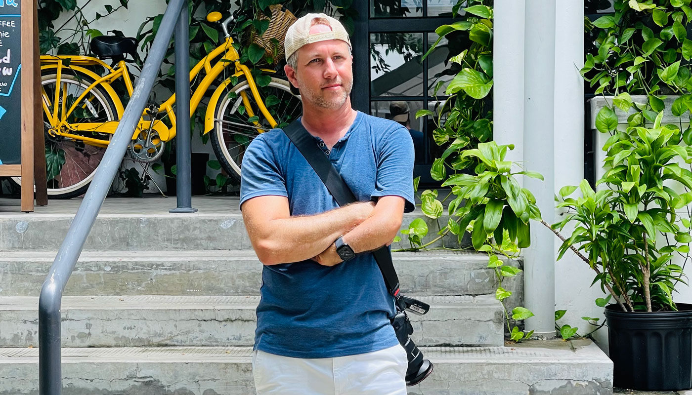 Michael Campo posing in front of steps