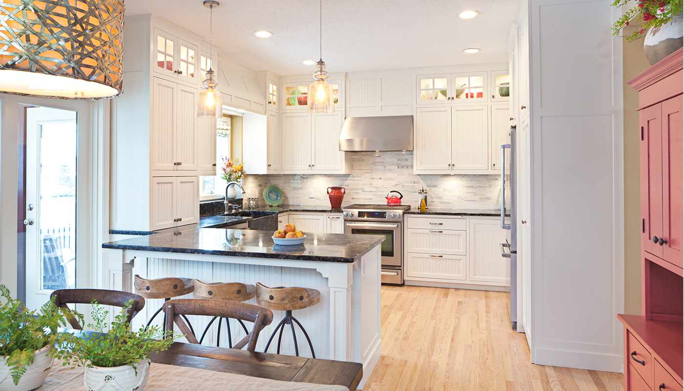 Photo of updated brightly lit open concept kitchen with new appliances 