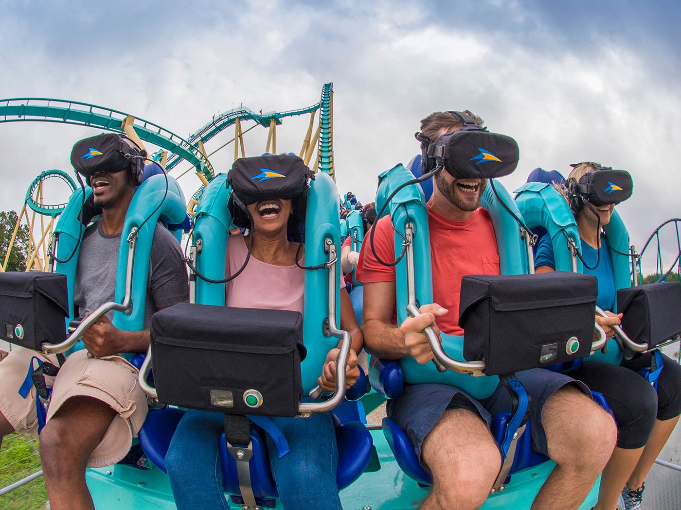 people on roller coaster wearing virtual reality headsets