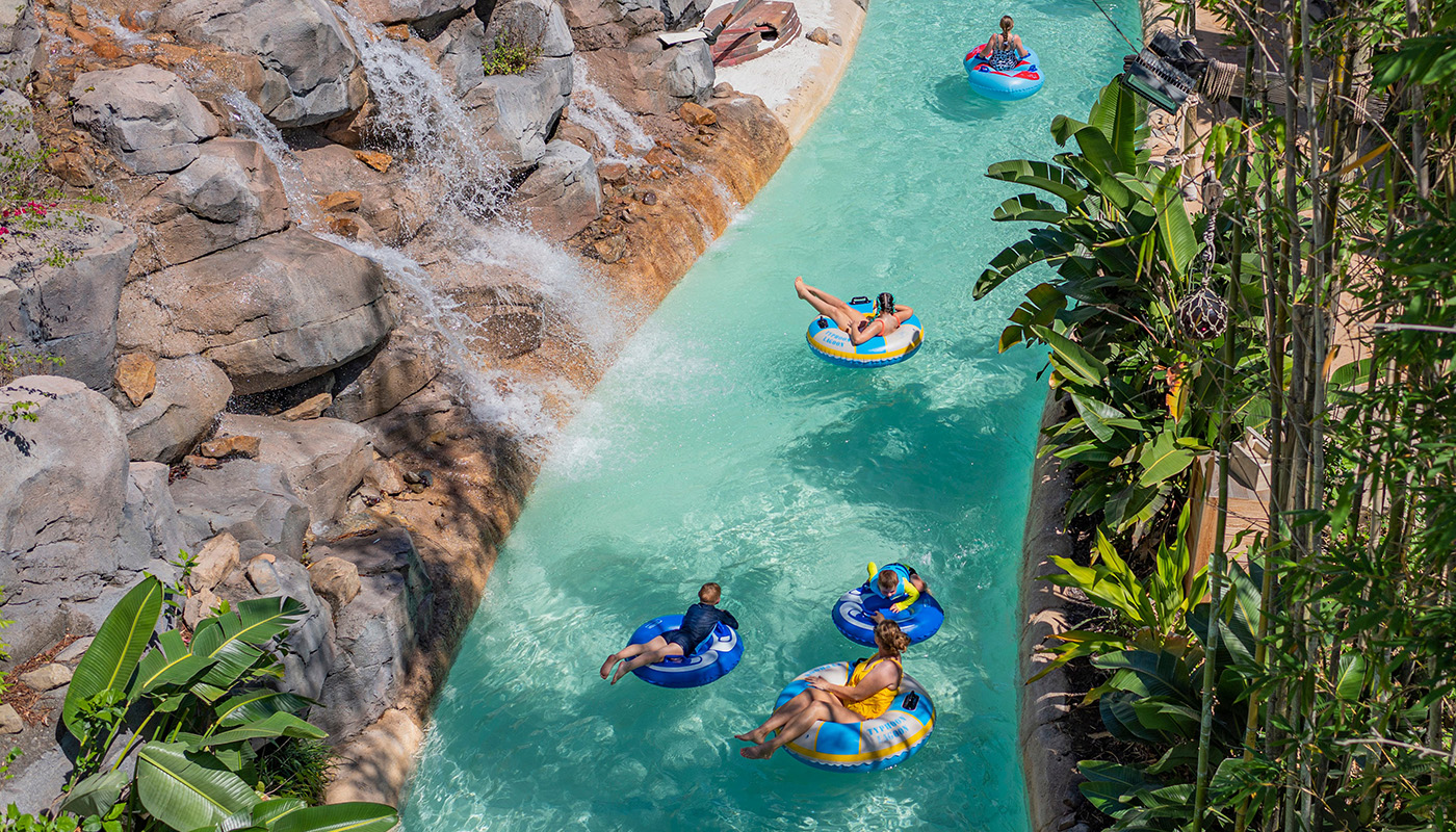 Park patrons on inner tubes floating down a section of Disney’s Typhoon Lagoon Water Park 