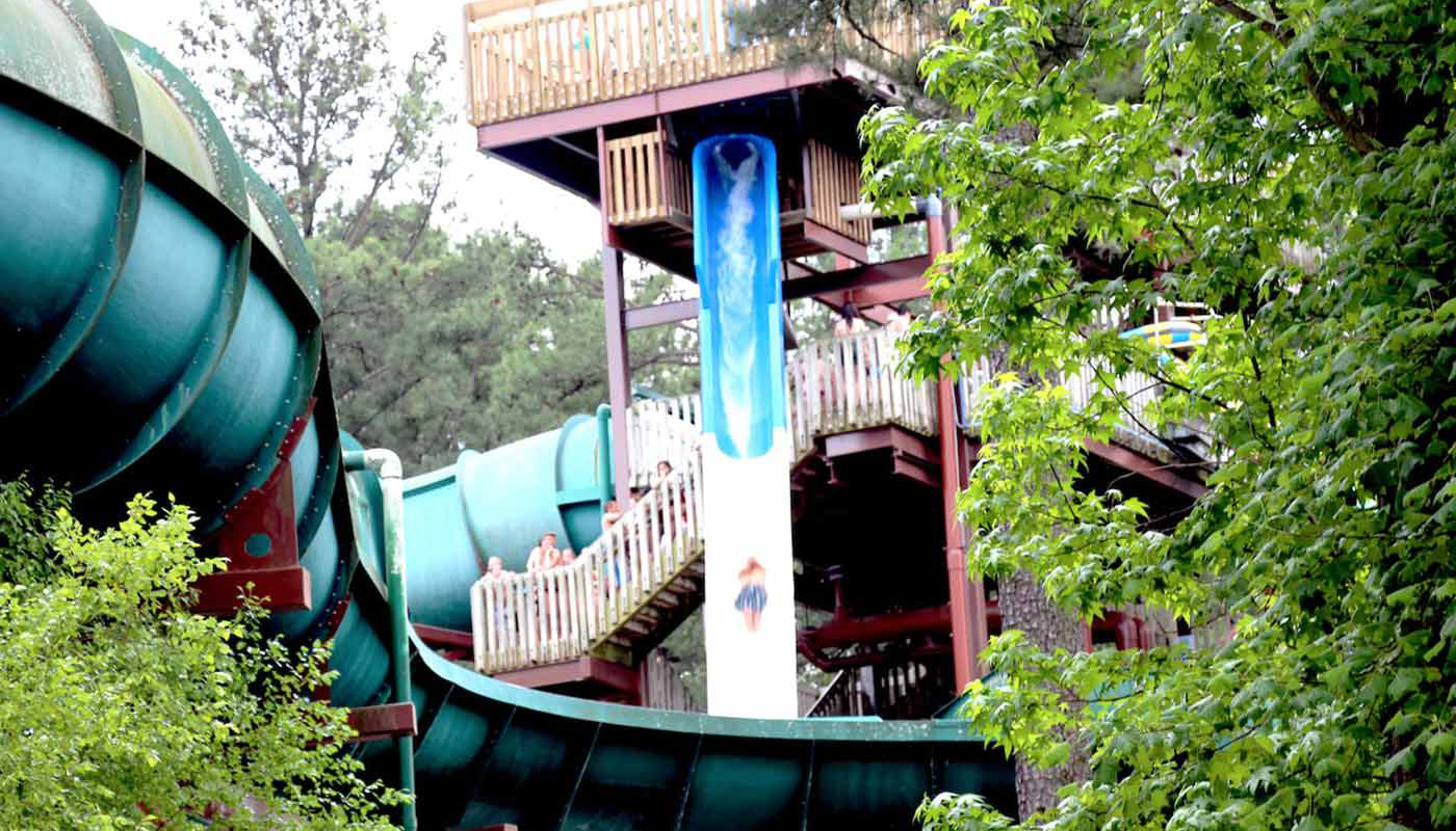 Park patrons waiting in line to ride a water slide at Six Flags White Water