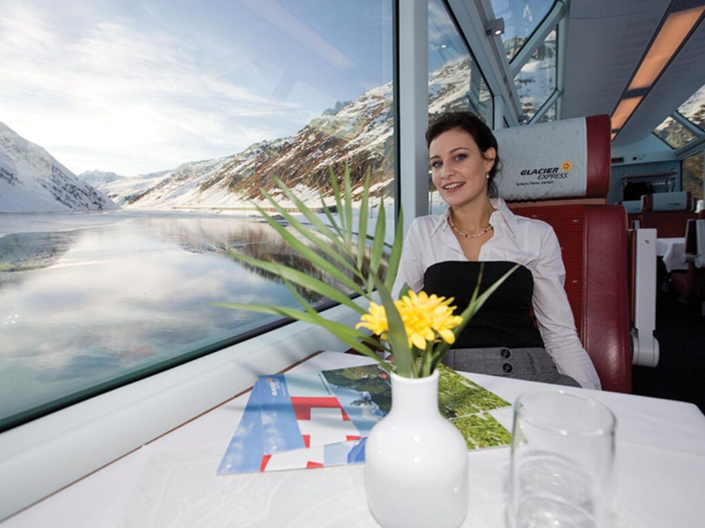 Panoramic viewing cars frame ice-capped Alps