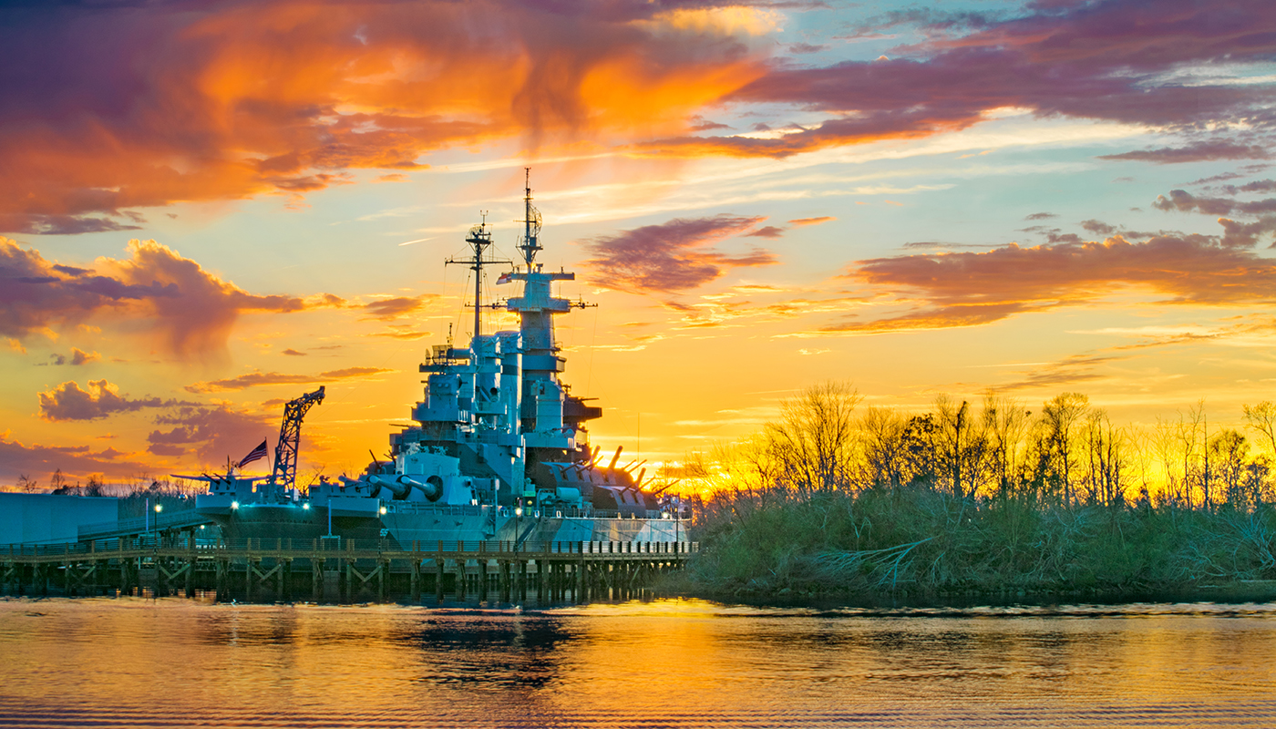 A sunset view of Battleship North Carolina in Wilmington, North Carolina.