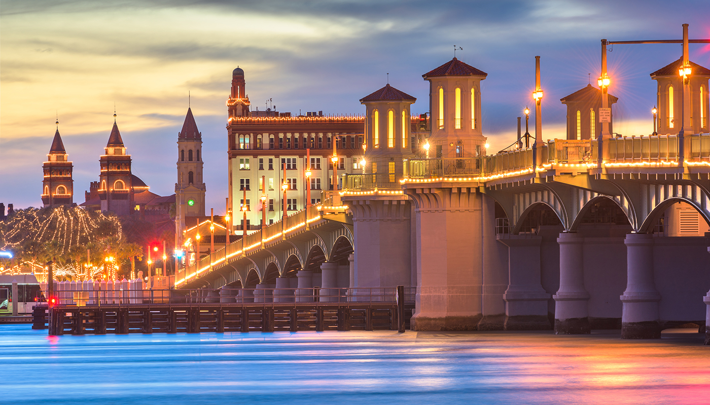 1189563586 St. Augustine, Florida skyline and Bridge of Lions at dusk
