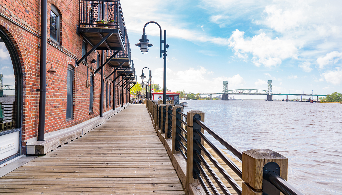 1148695779 Riverwalk along the waterfront of the Cape Fear River in Wilmington, North Carolina