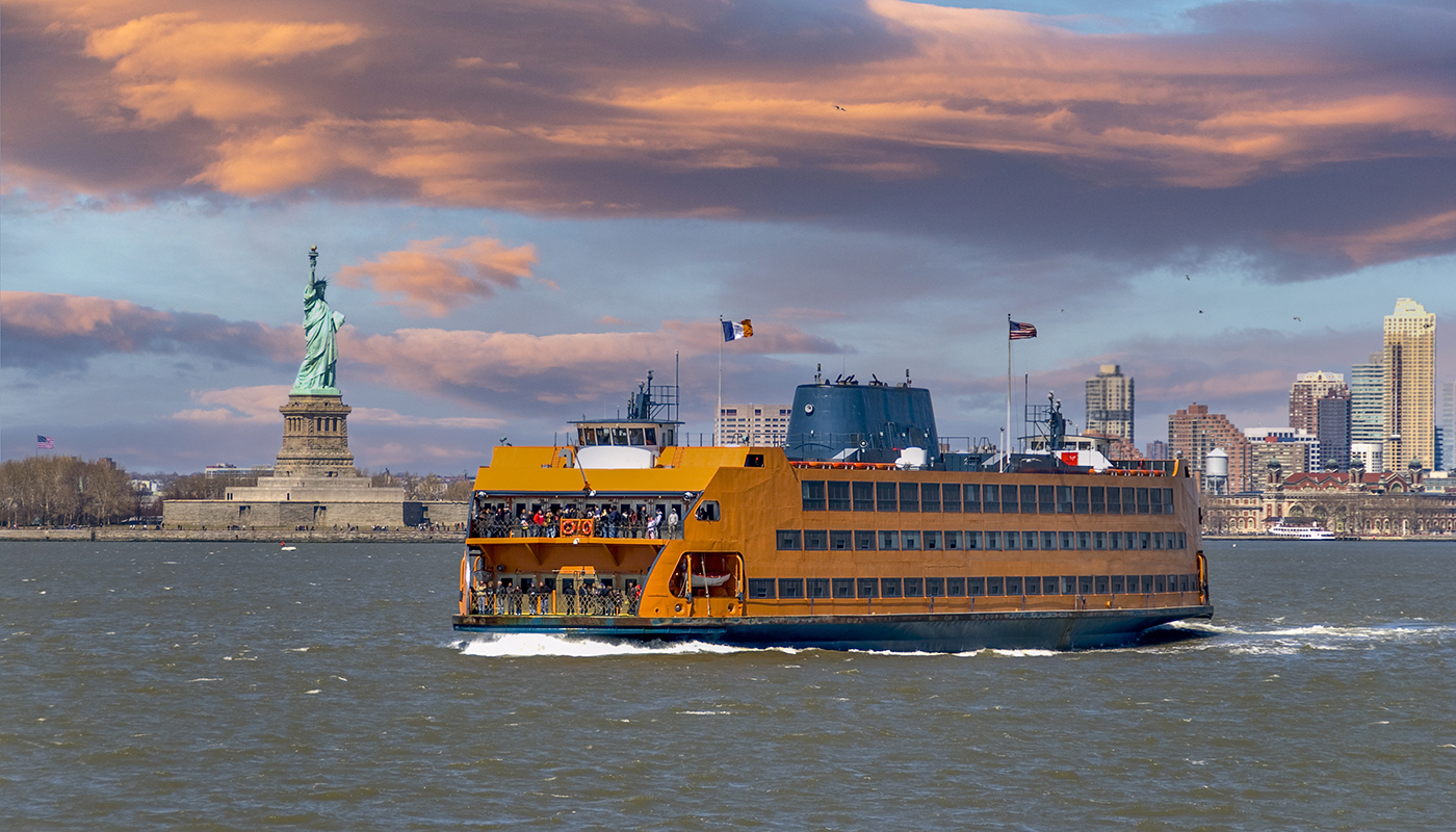 A ferry makes its way past the Statue of Liberty.