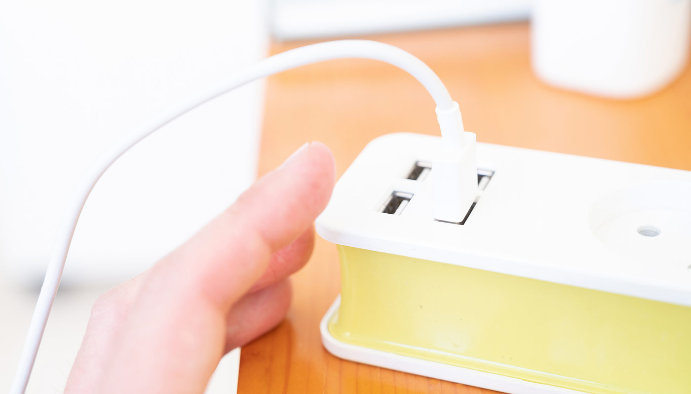 A power strip with a plug in one of the USB outlets. 
