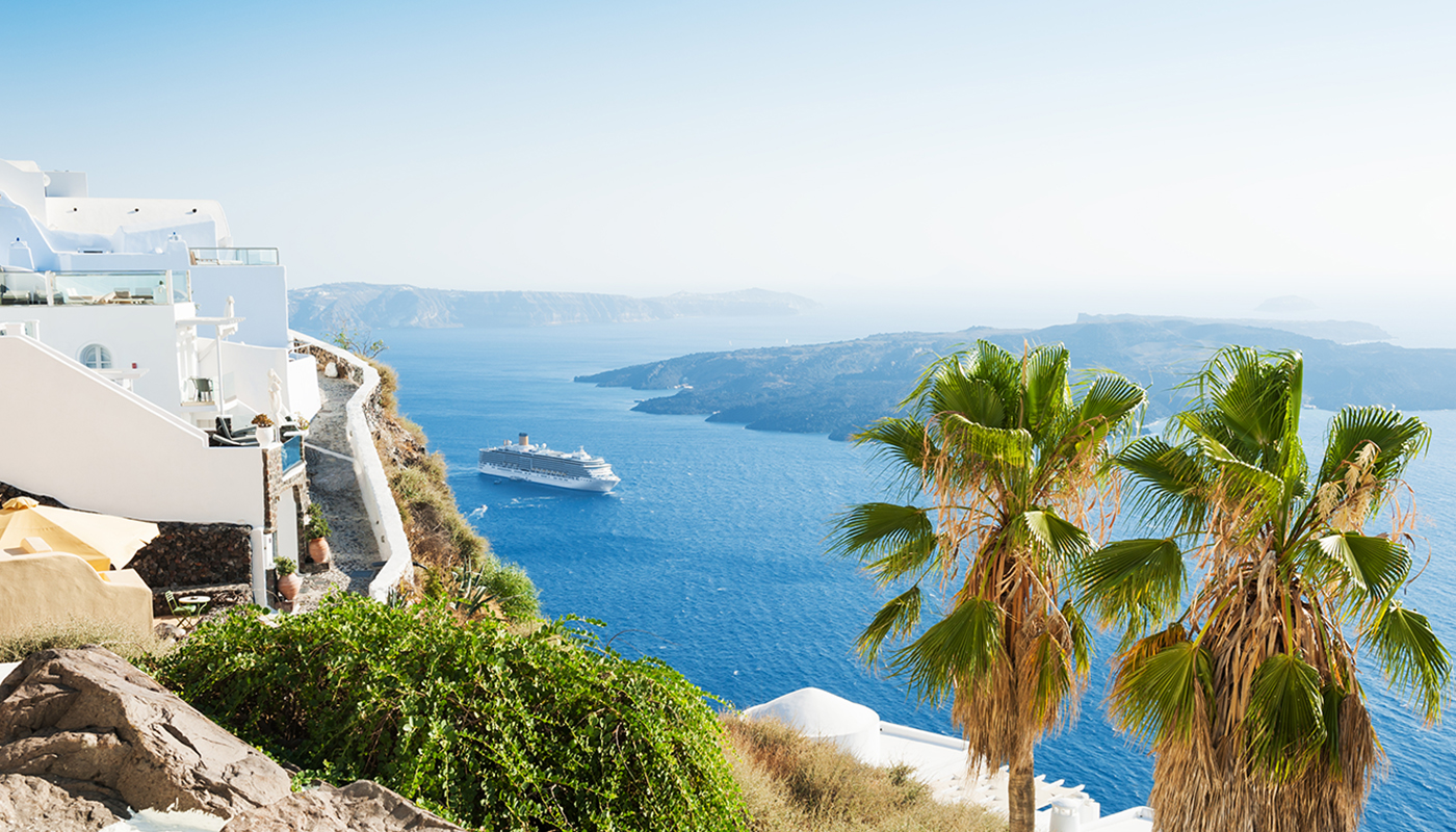 Cruise ship sailing by Santorini island, Greece 