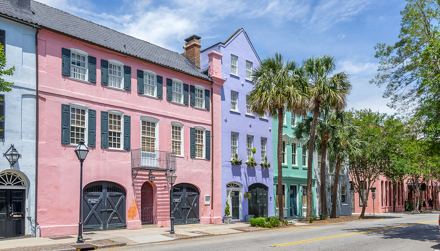 Colorful pastel houses line the street at Rainbow Row in Charleston, South Carolina