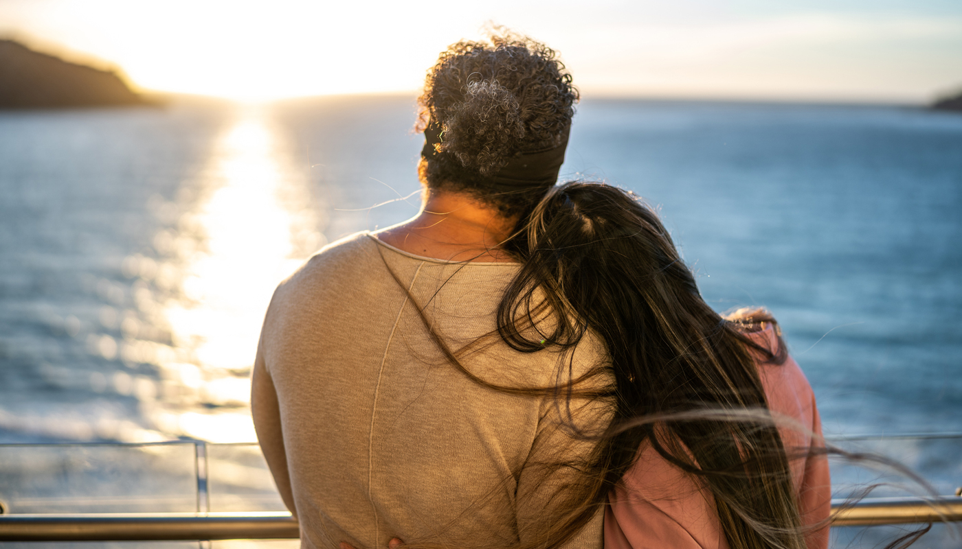 Couple catching the sunset on a cruise