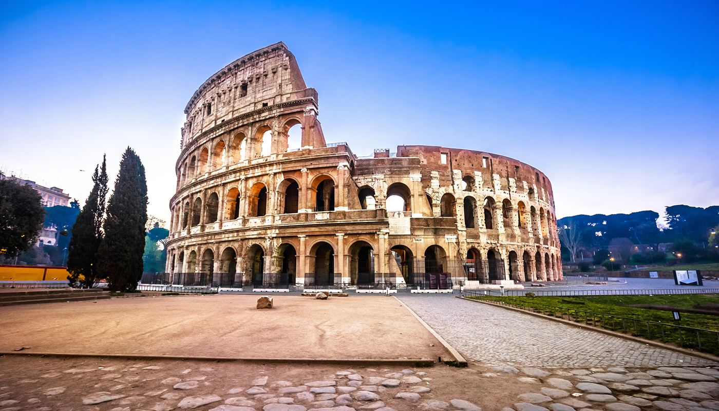 Rome. Empty Colosseum square in Rome dawn view, the most famous landmark of eternal city, capital of Italy