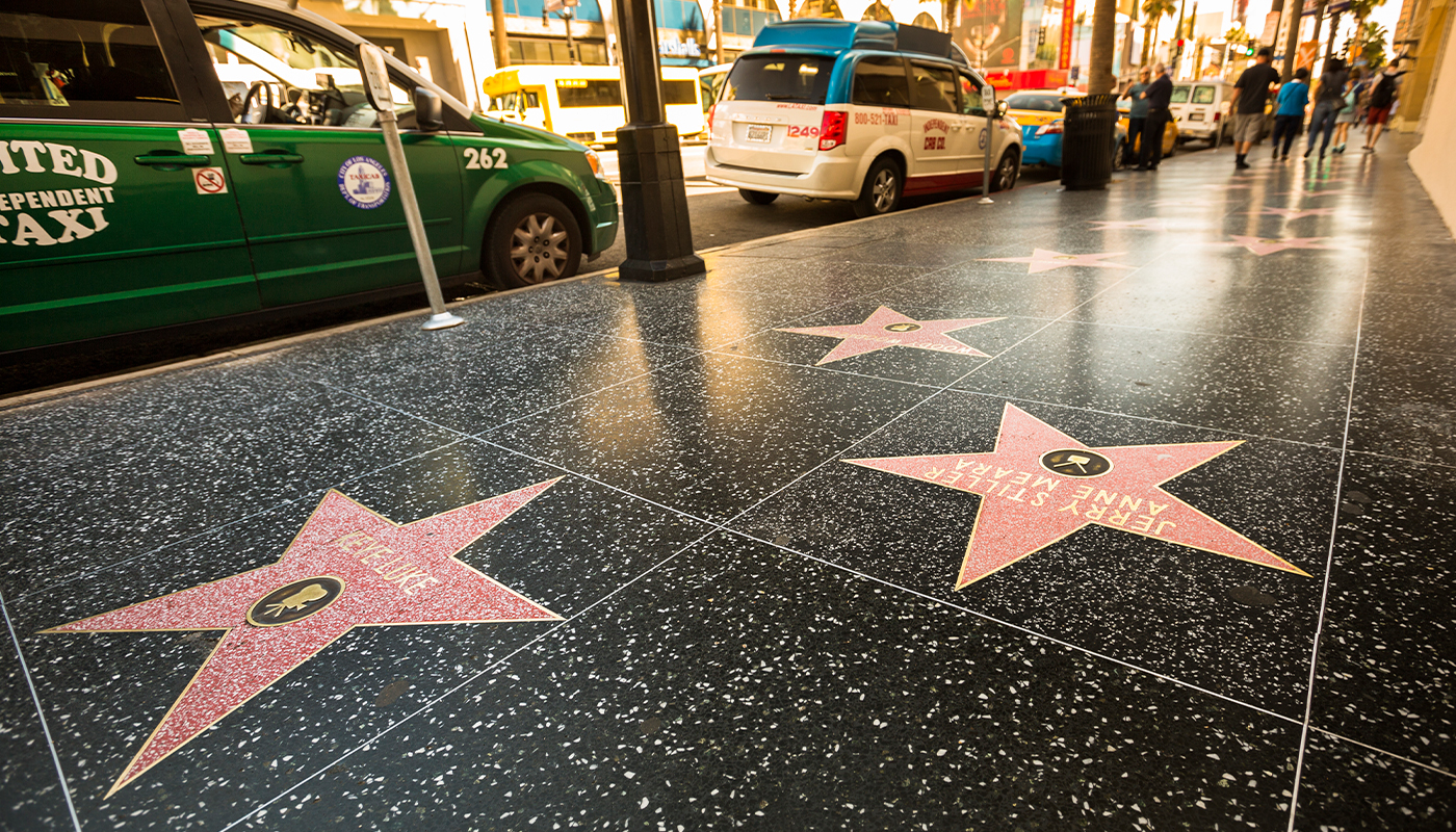 A stretch of the famous Hollywood Walk of Fame at night.