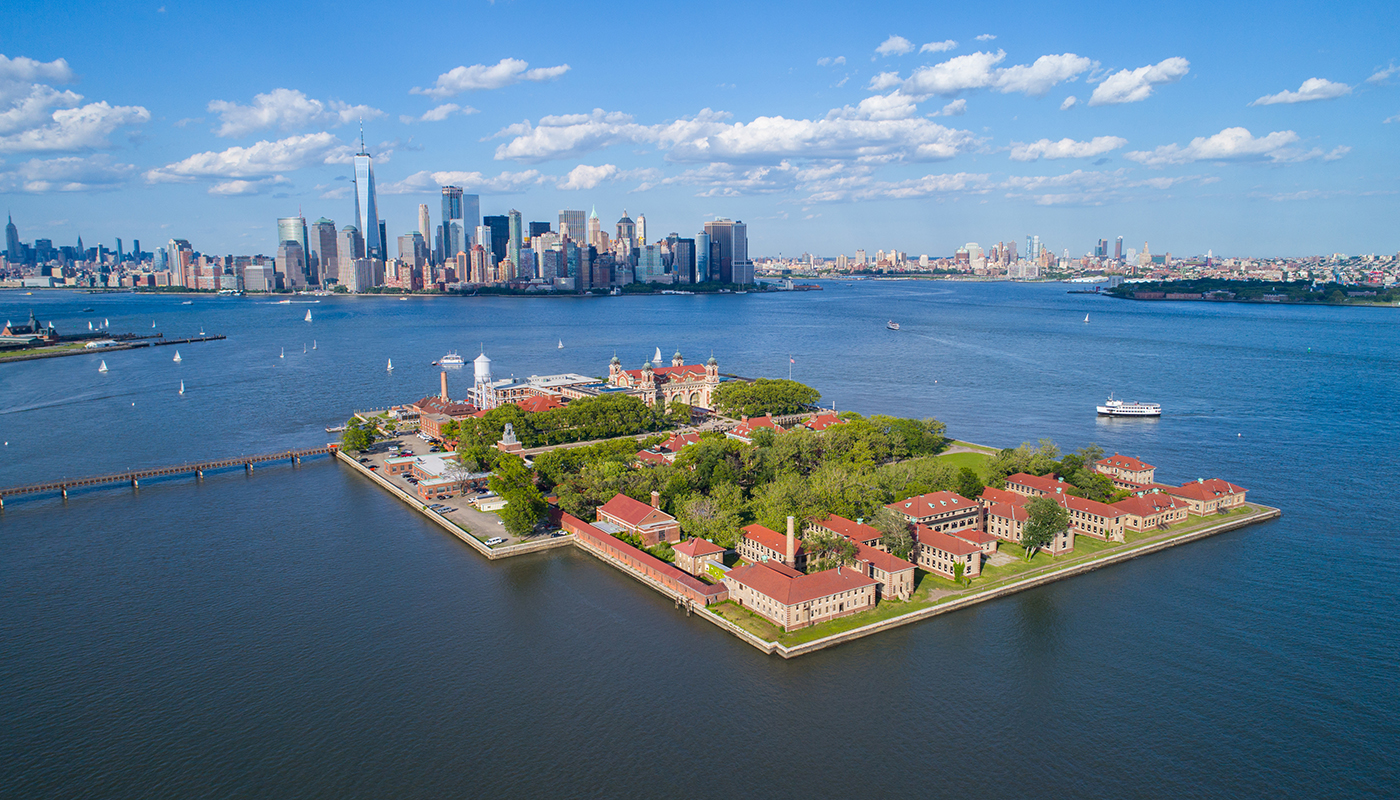 Ellis Island with the New York skyline in the distance.