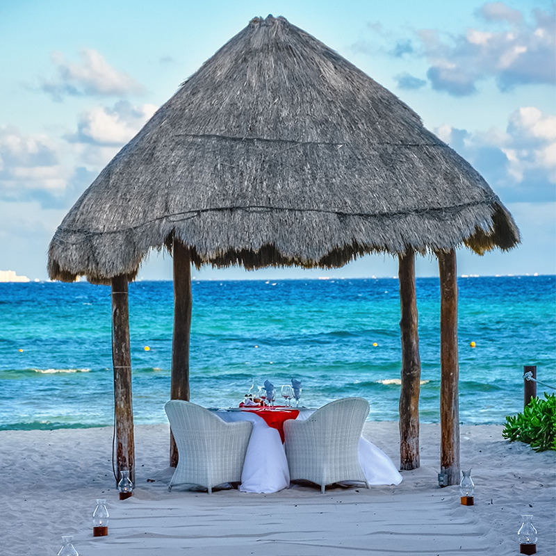 A setup for a romantic dinner by the sea in Playa del Carmen in Mexico.