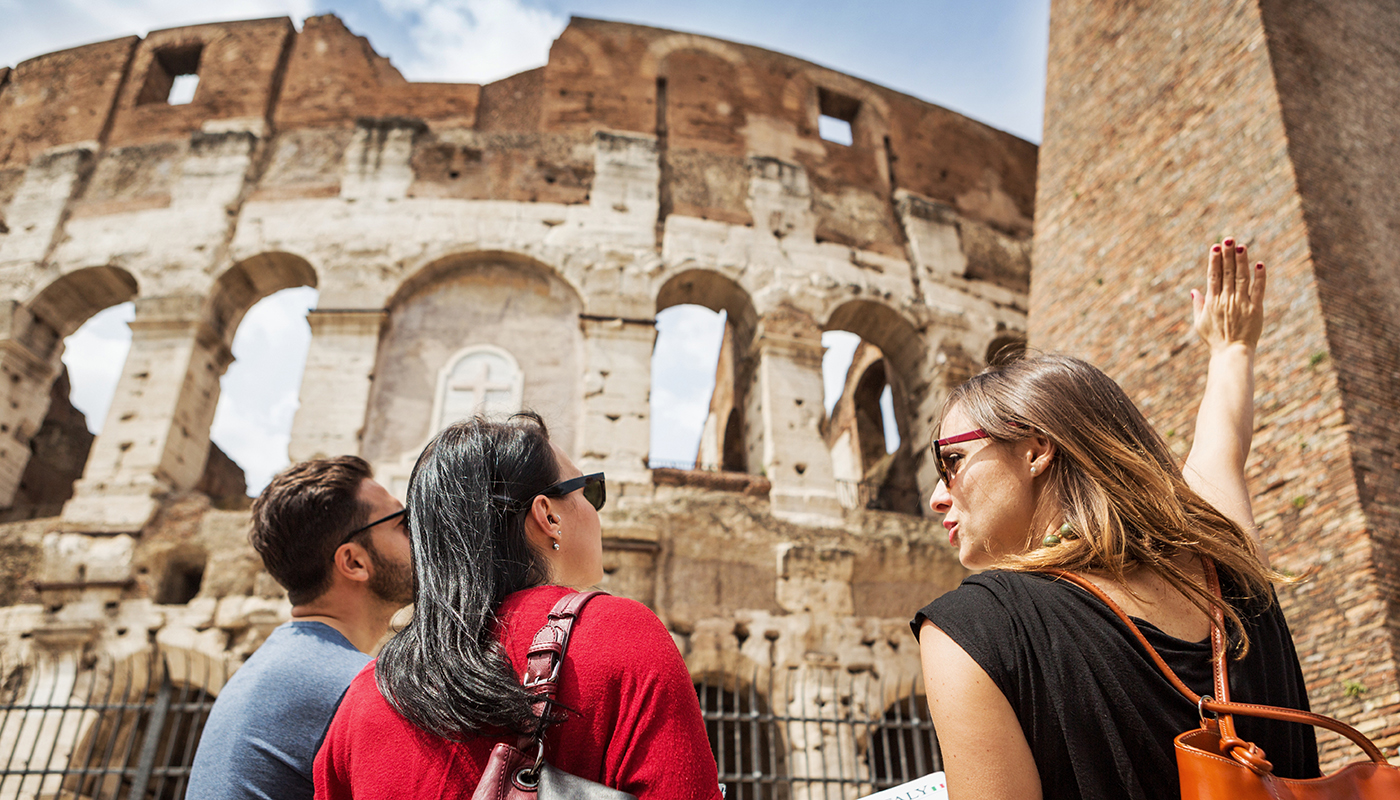 Tourists with a guide in front of the Coliseum, Rome
