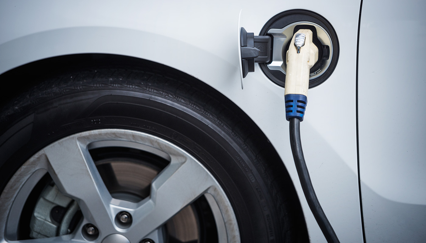 Closeup of electric vehicle recharging its battery
