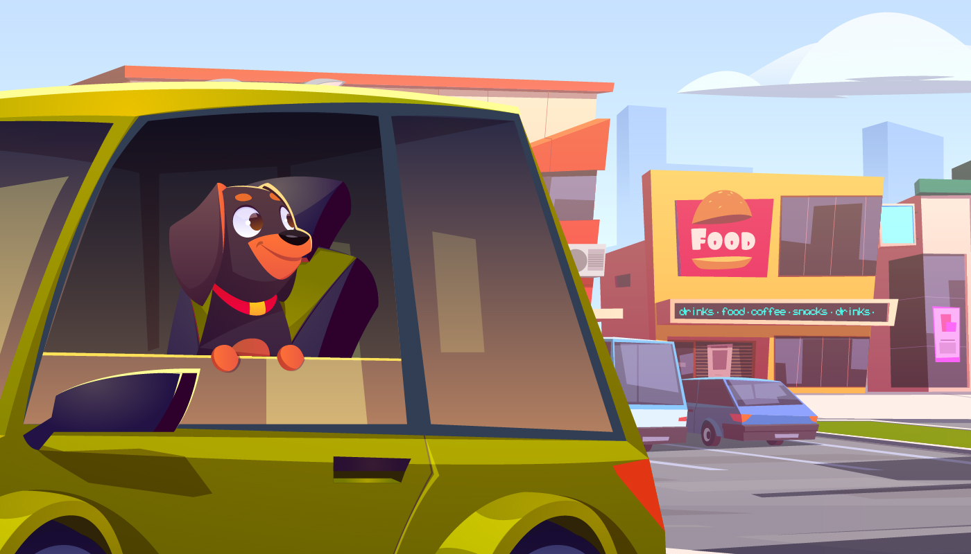 Dog in car with window down with shops and restaurants in the background