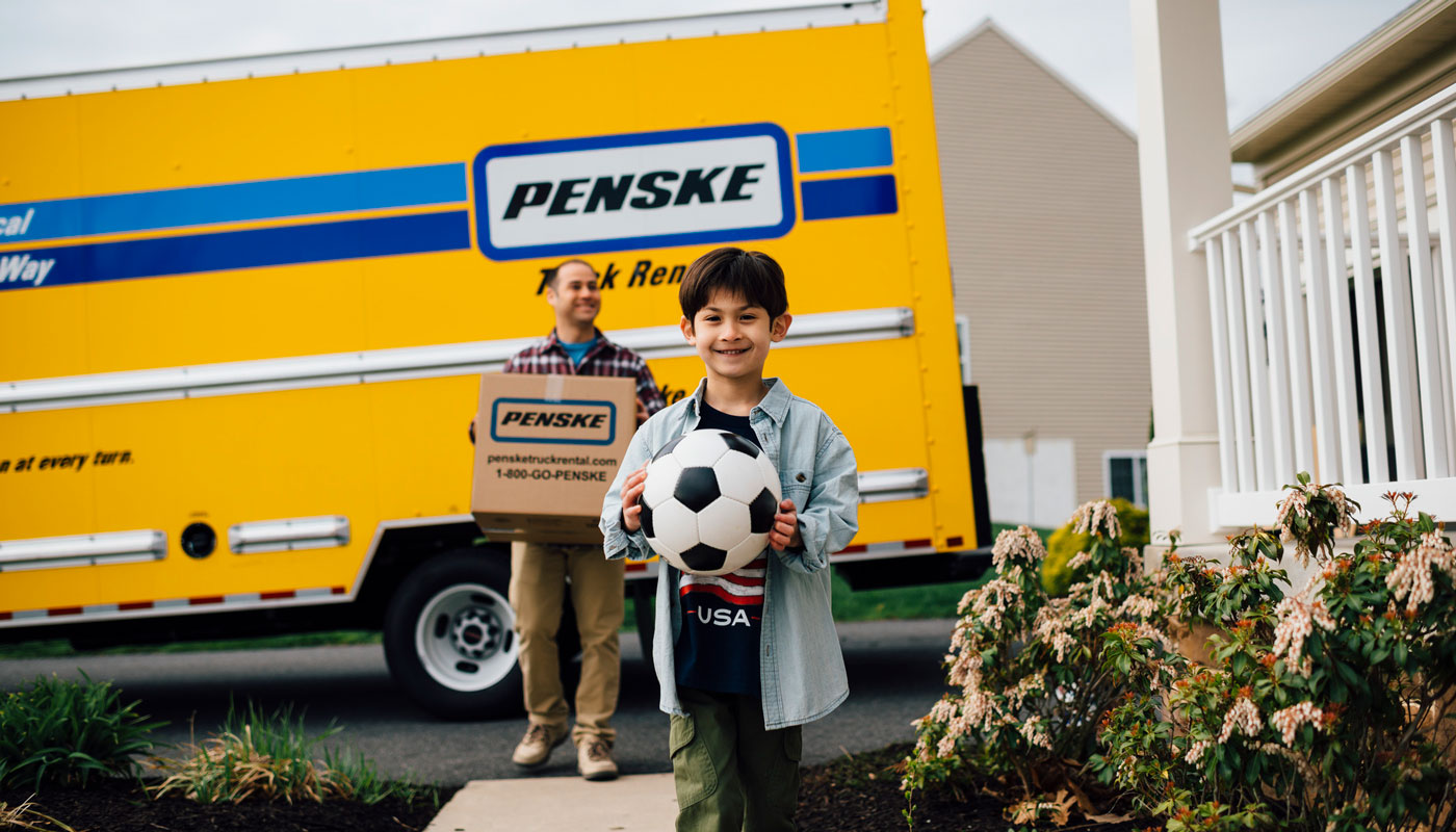Penske moving truck with father and son 