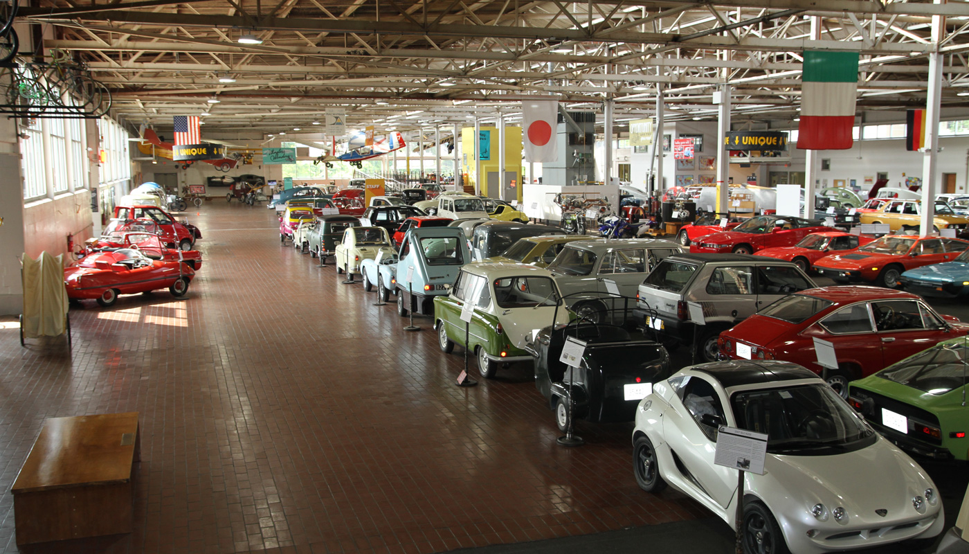 Multiple cars lined up inside Lane Motor Museum