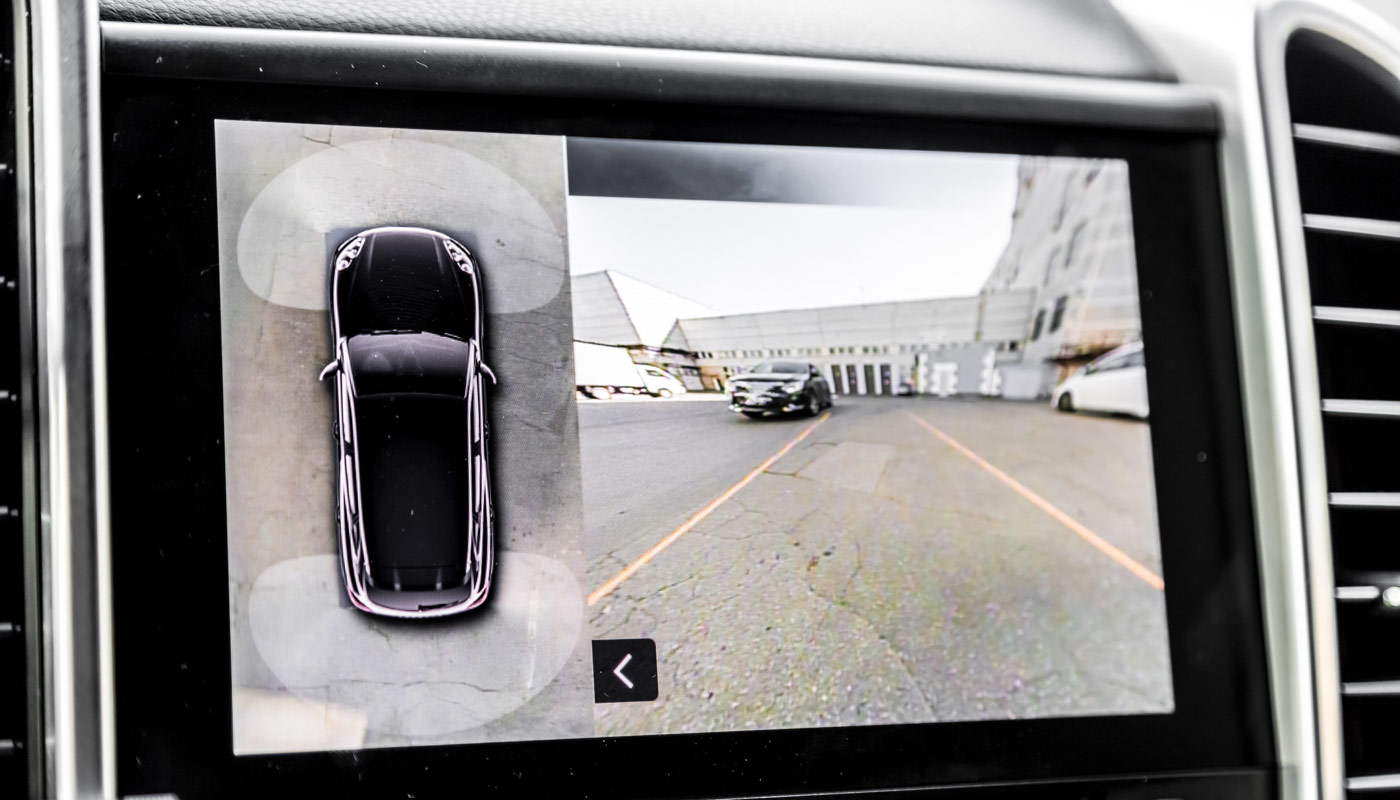 Working of front camera of circular 360 degrees view system. Image display on the head unit. Multimedia in the car. Options inside automobile
