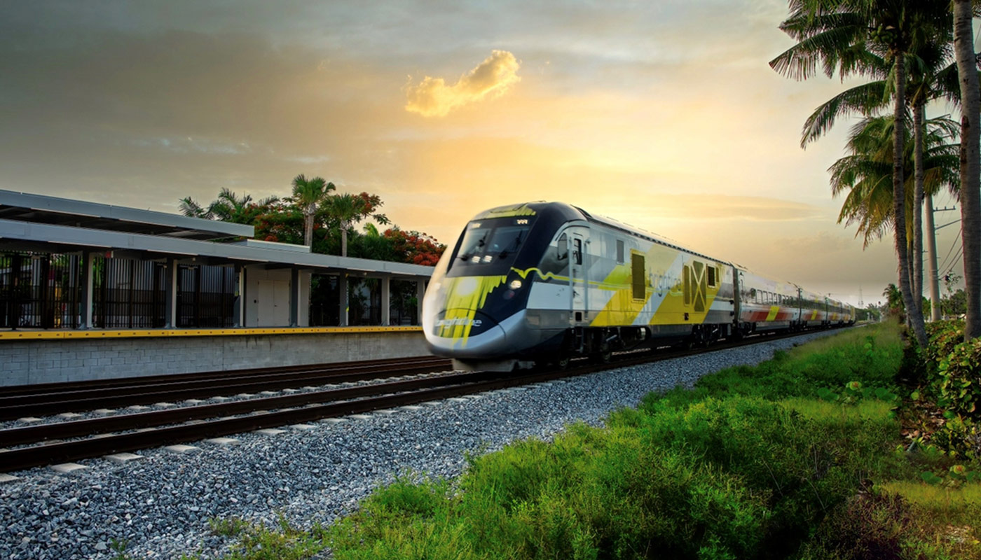 Brightline train traveling with sunset in background