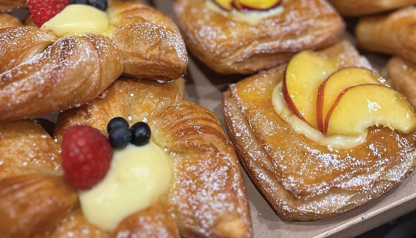 Close up of breakfast pastries with fruit on top