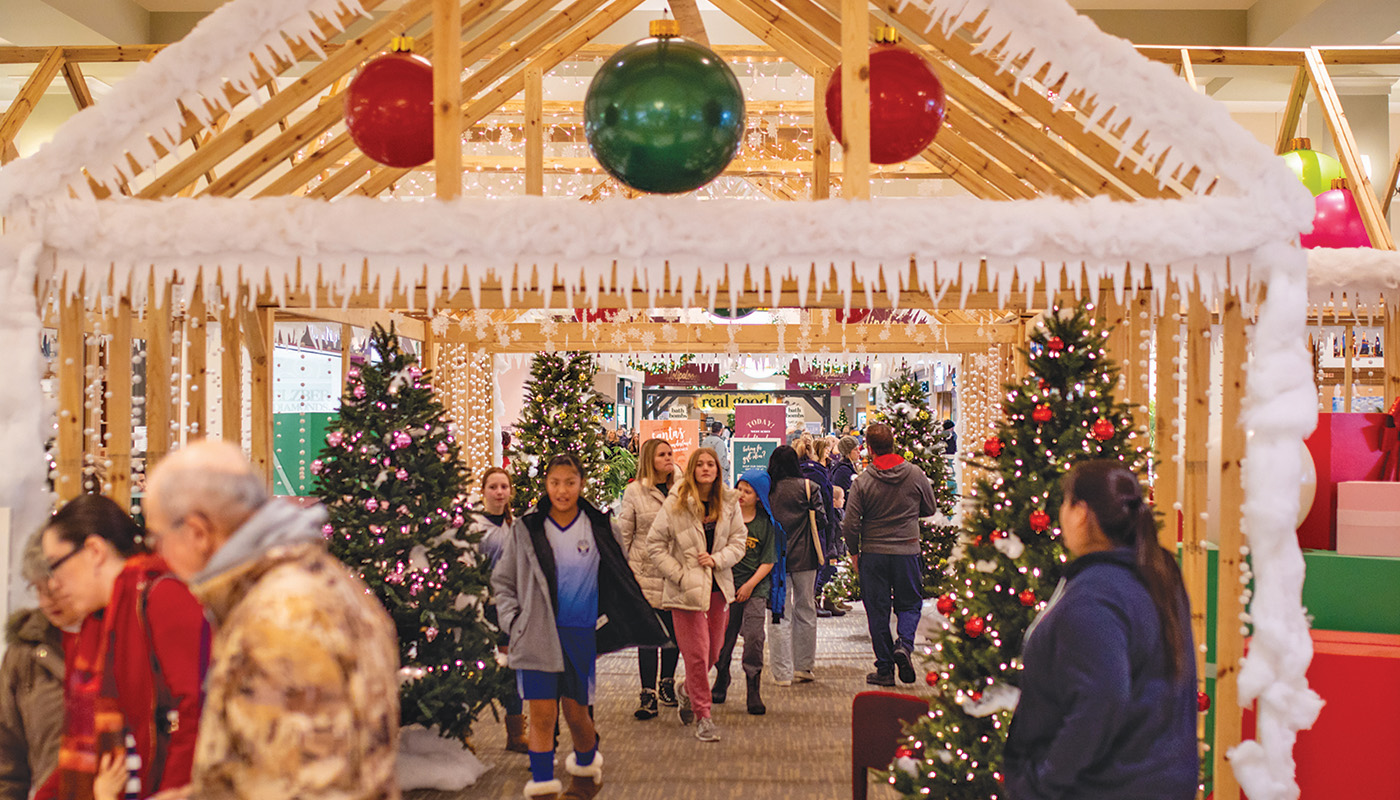 Shoppers mingle among holiday decorations at West Acres