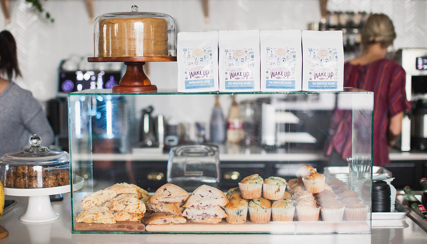 Pastries and baked goods displayed in glass case at Wake Up Coffee Co.