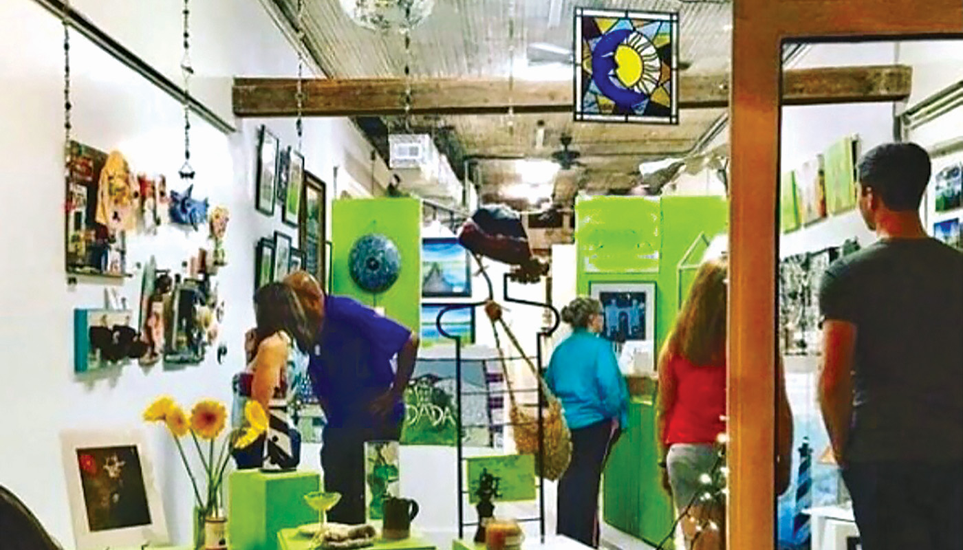 Customers browse in an art gallery