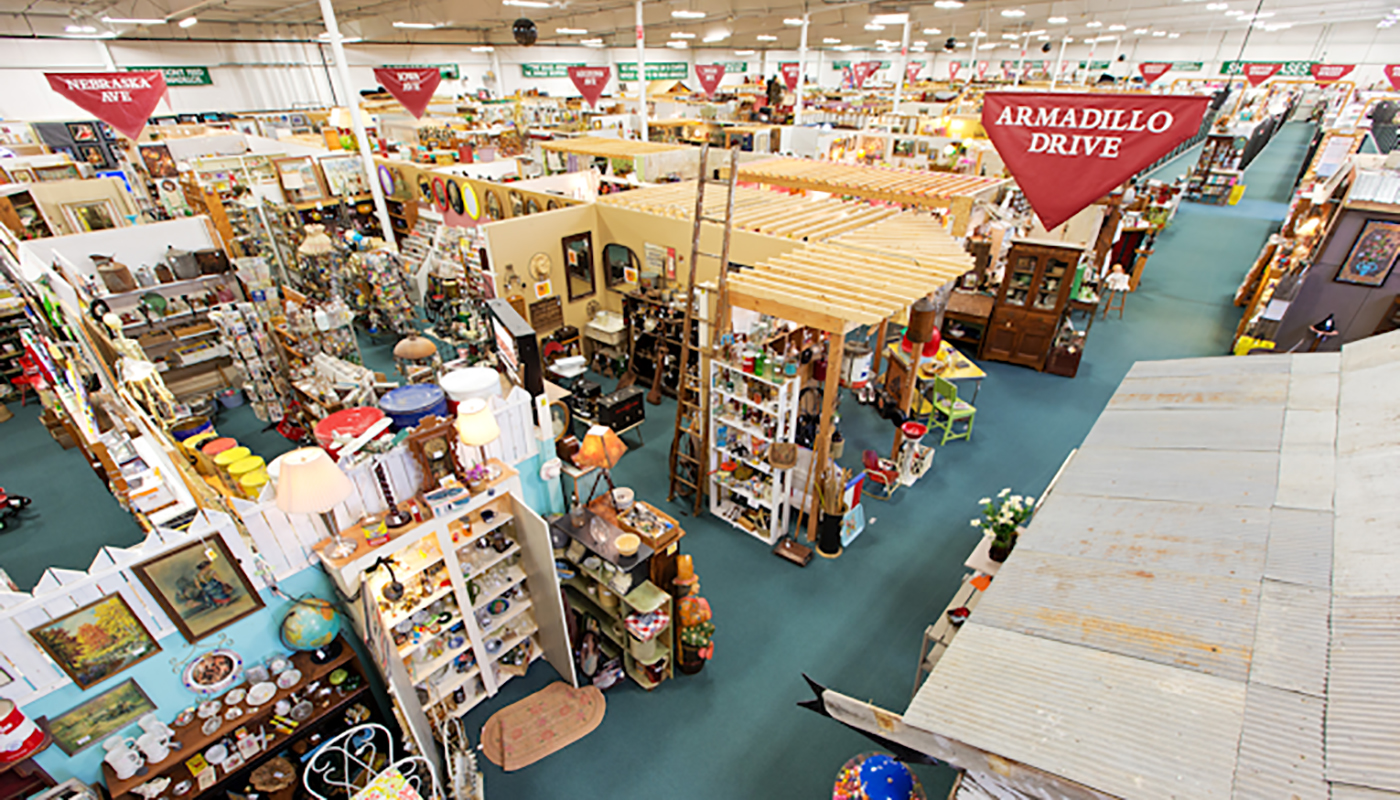 Overhead view of numerous display shelves in an antique mall. 