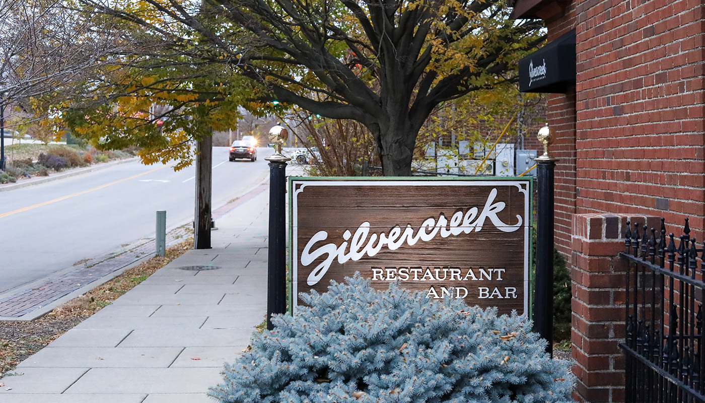 Exterior view of brick building with Silvercreek Restaurant signage