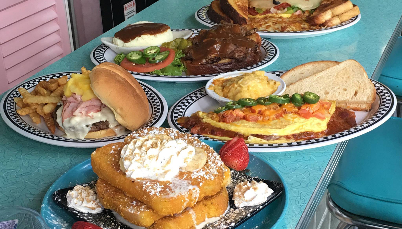 Spread of various breakfast dishes on a counter from Johnny Angel's