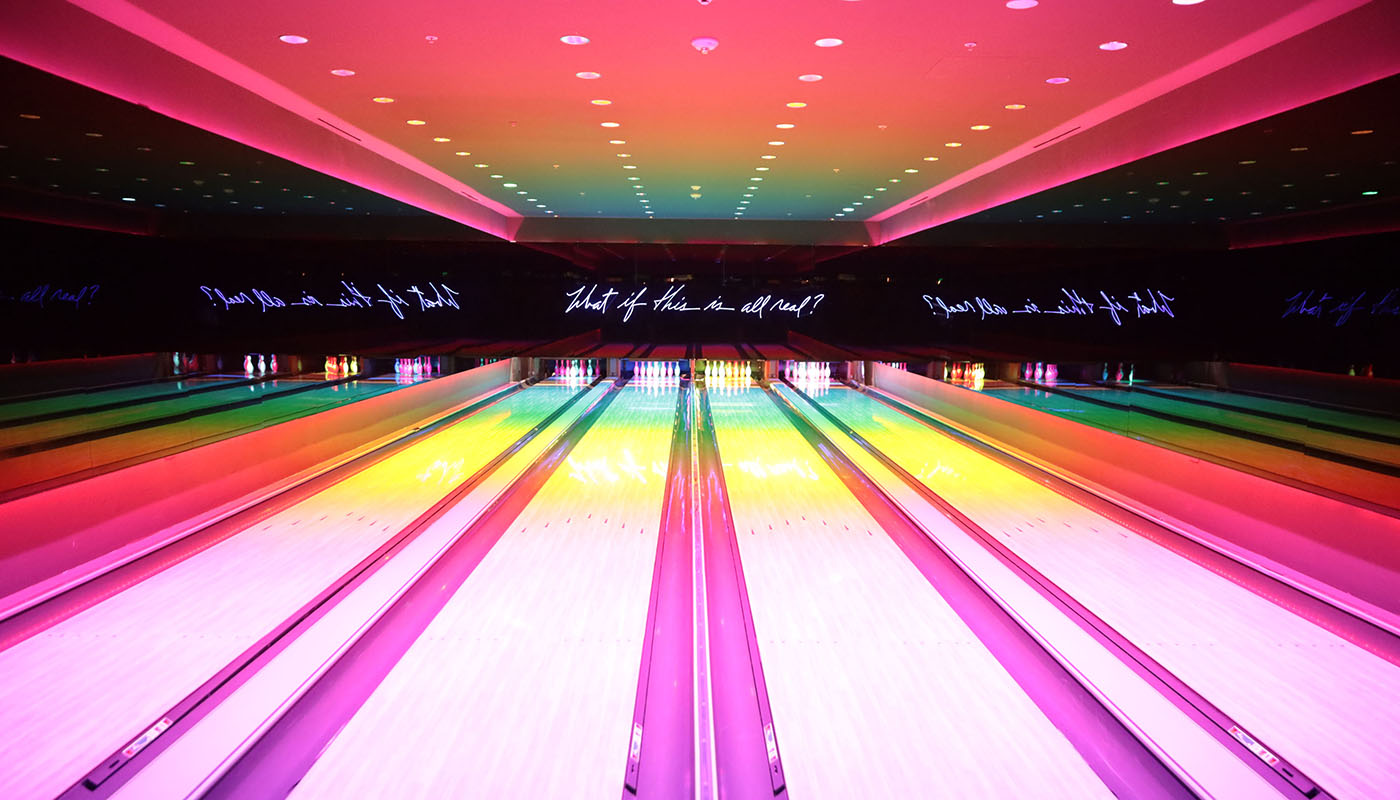 Colorful and illuminated bowling alley lanes