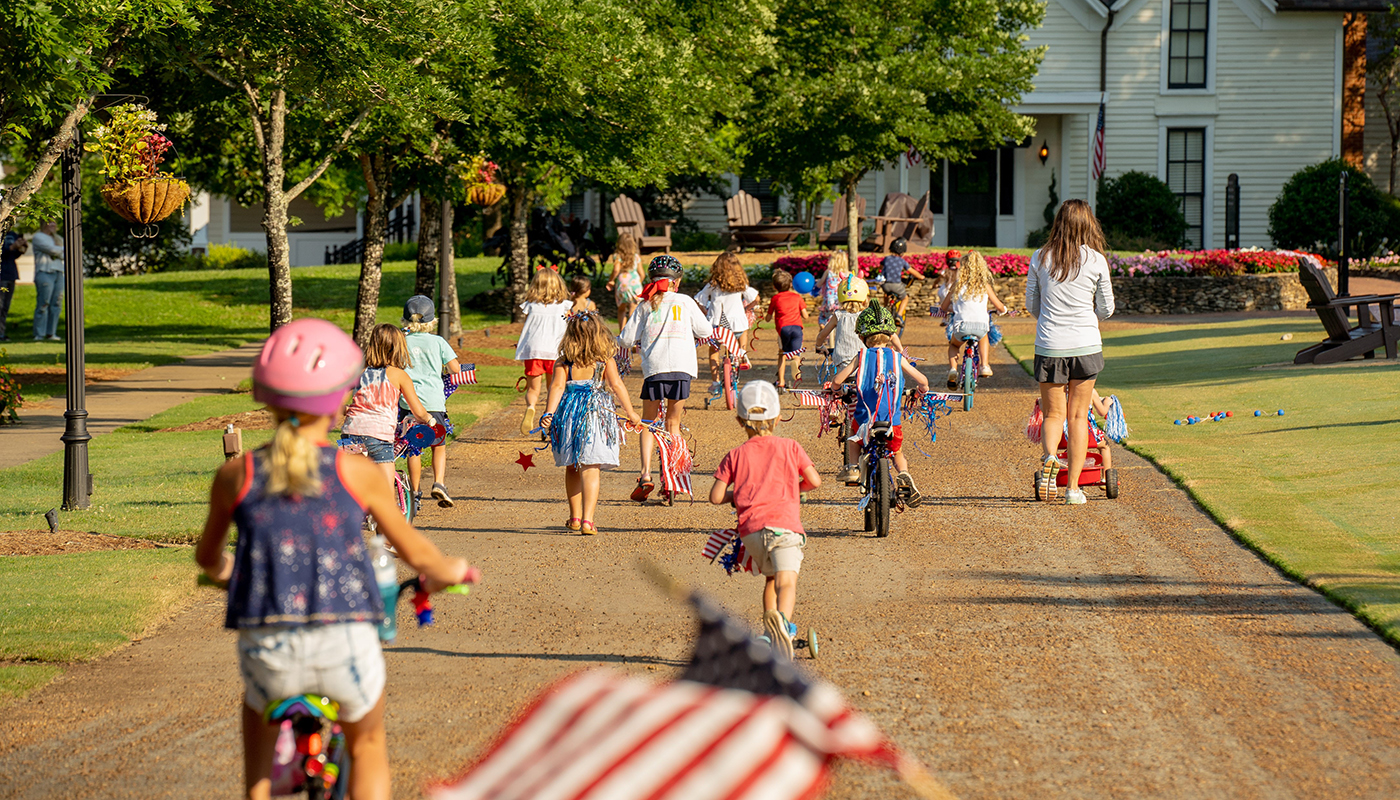 Children ride bikes at Barnsley Resort during the All American Cookout & Fireworks event.