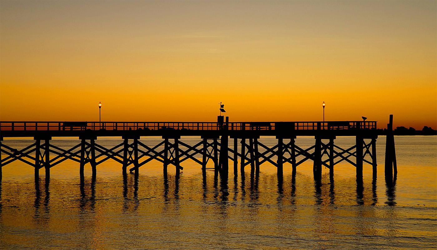 A pier at sunset.