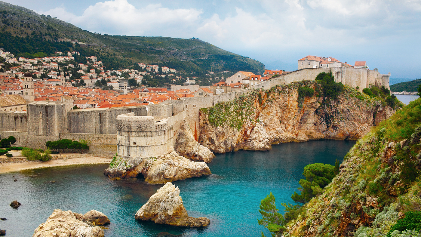 The medieval city walls of Dubrovnik, Croatia, overlook the Mediterranean Sea