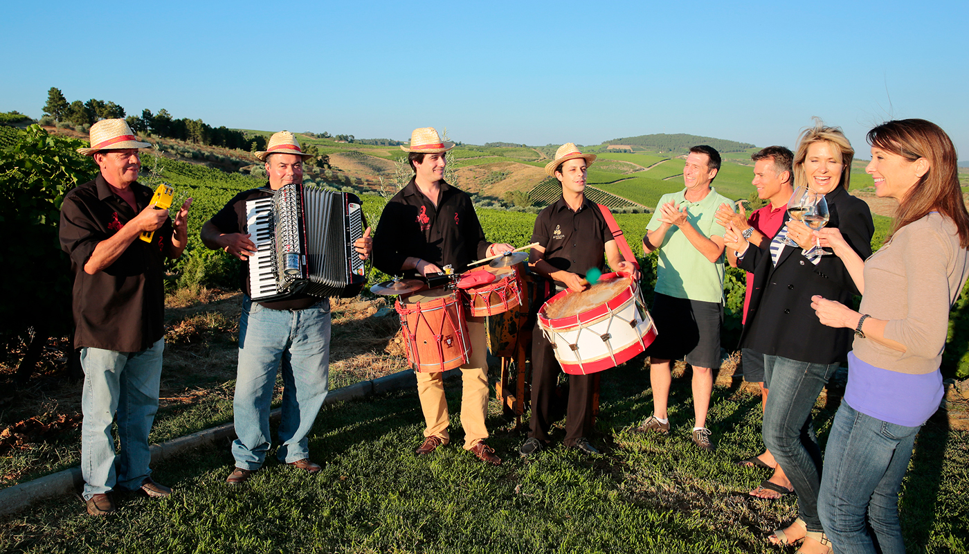 Local musicians play for guests during a winery tour in Pinhão, Portugal, on the Douro River. 