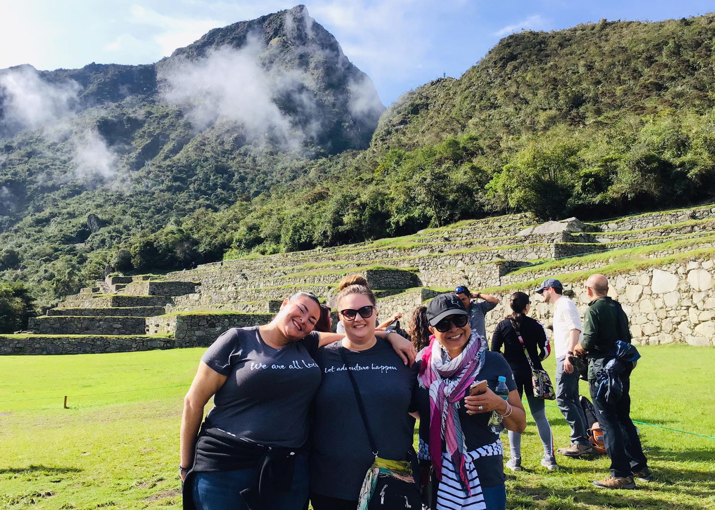 A group of 3 women at the base of Machu Picchu