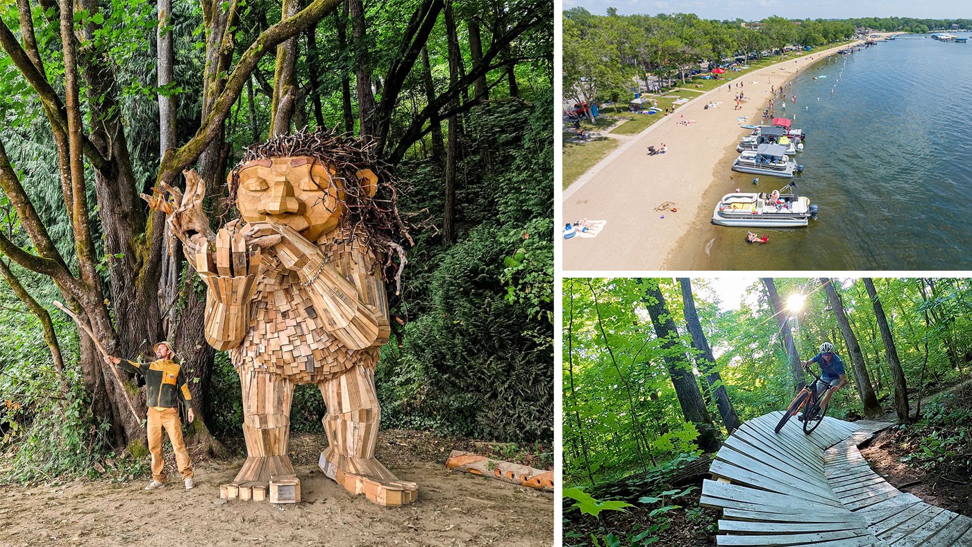 Photo of a wood troll sculpture by Thomas Dambo, photo of boats pulled up to a sandy beach with a grassy picnic area behind it. People are sitting and walking on the beach and on the grass.